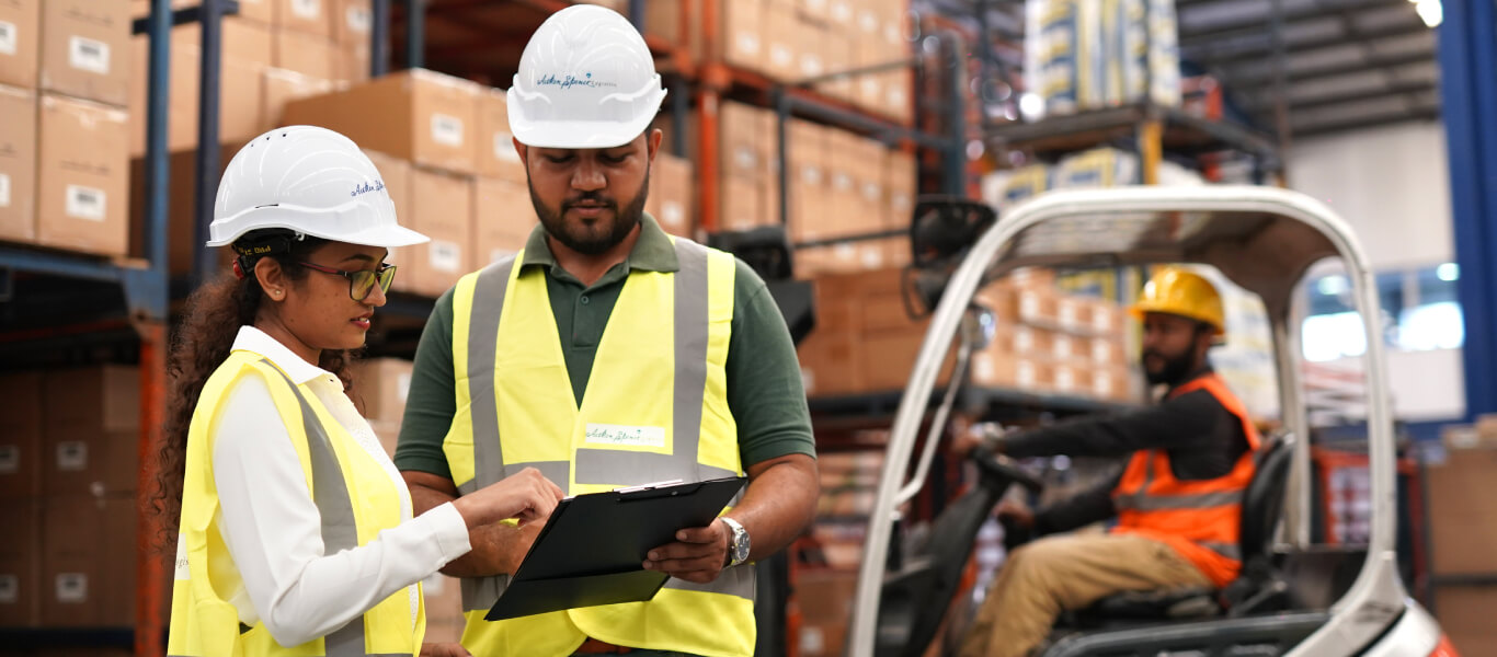Workers performing a warehouse survey, with a clipboard in hand