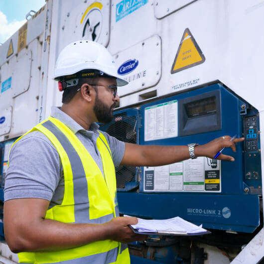 A worker operating the Reefer Container Plugging Facilities